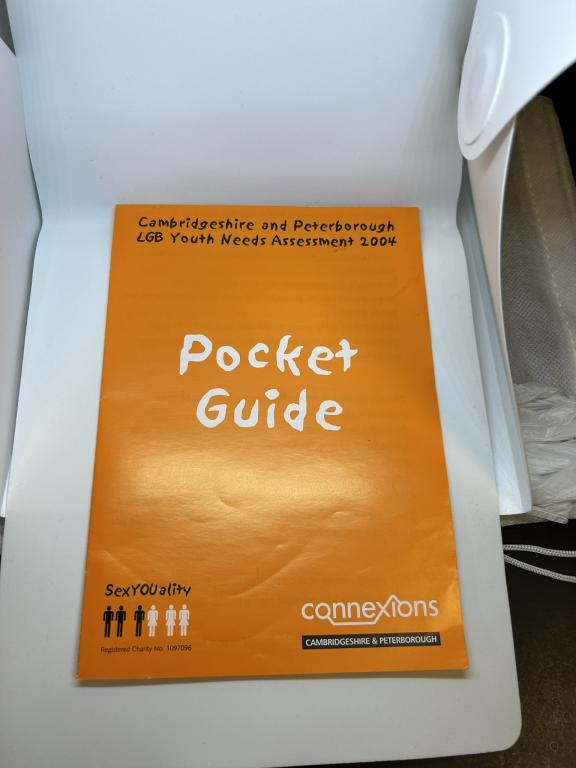 an orange leaflet with the text "pocket guide" and "Cambridgeshire and peterborough  LGB youth needs assessment 2004"