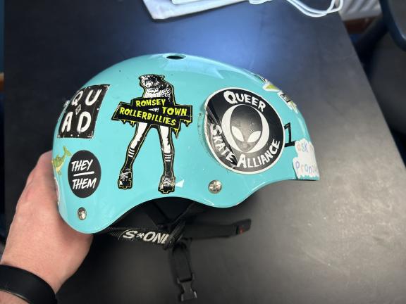 a blue helmet with stickers