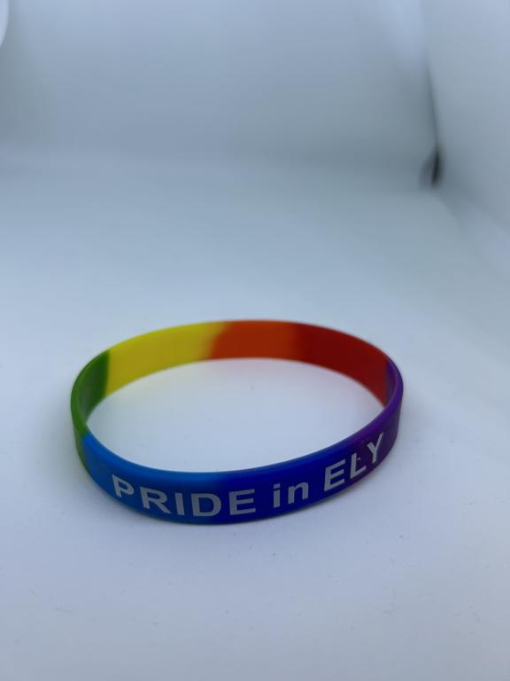 a rainbow plastic wristband