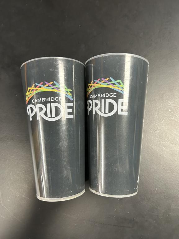 two plastic cups with the cambridge pride logo